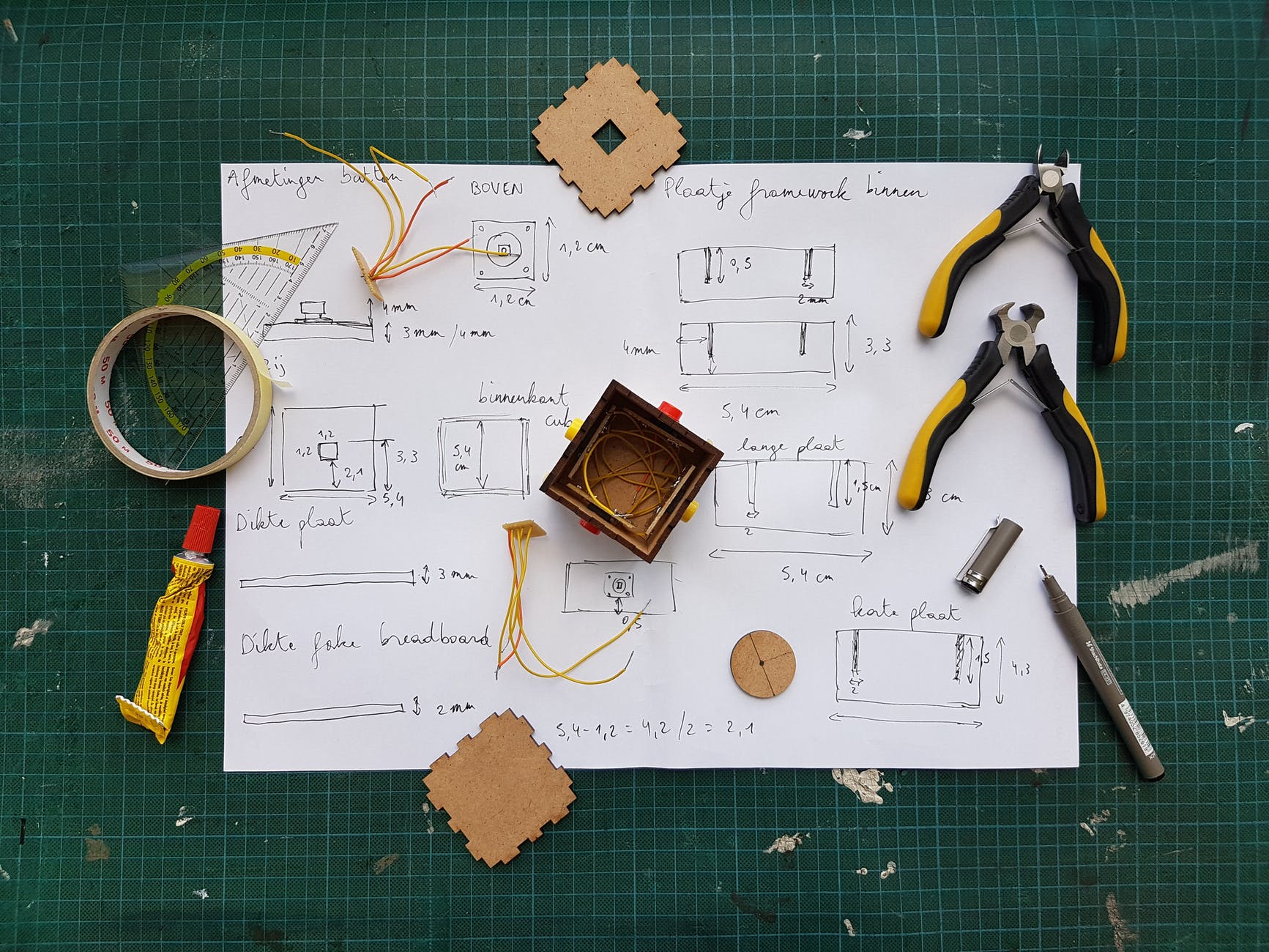 white diagram paper under pliers