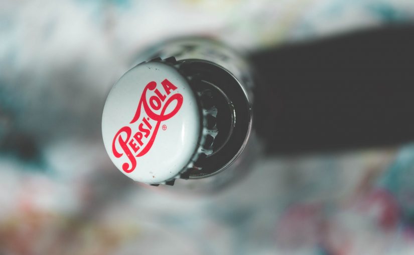 shallow focus photography of pepsi cola bottle cap